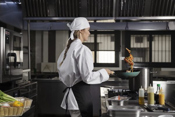 female-chef-kitchen-frying-food